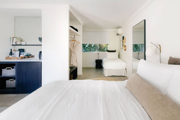 Junior King Plus room with king bed, walk-in dressing area and mirror